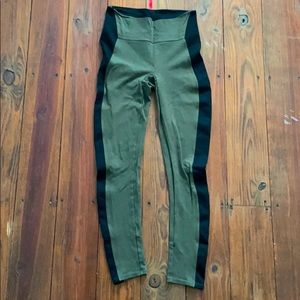 Army green Spanx leggings with black stripe